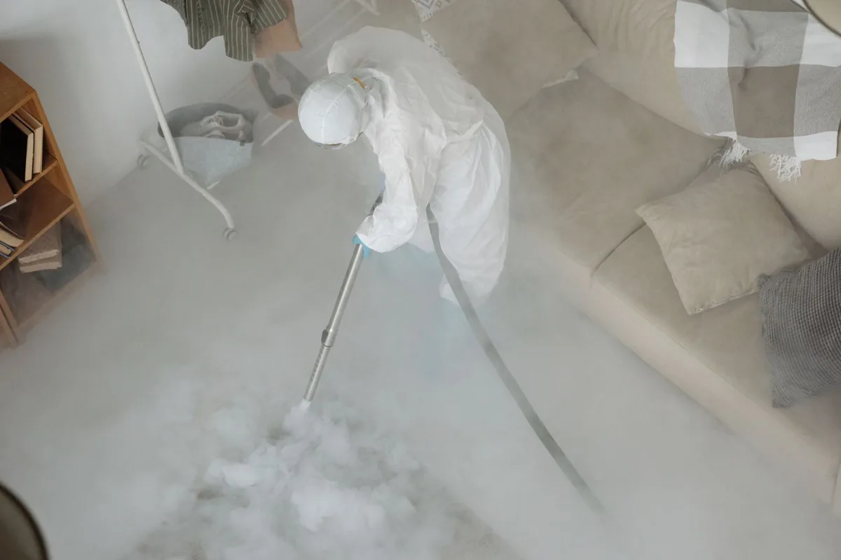 Biohazard cleanup technician in protective equipment, Wapato, WA